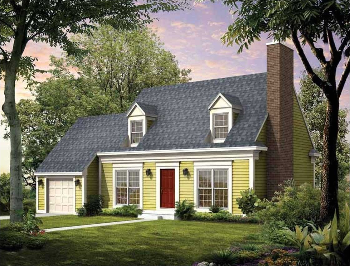 cape cod house style with garage designed with green wall paint ideas combine with white garage door and natural brown main door also with gray roof tile