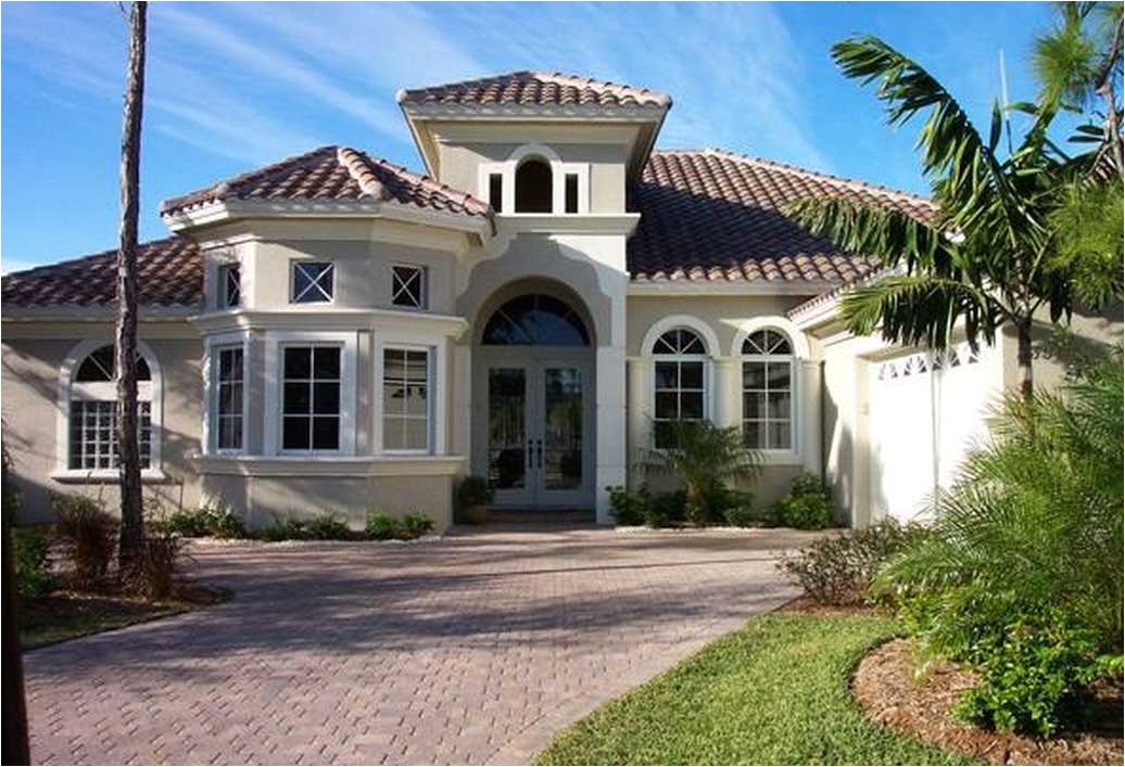 awesome mediterranean home design with cream wall paint color ideas combine with orange clay roof tile complete with the palm tree