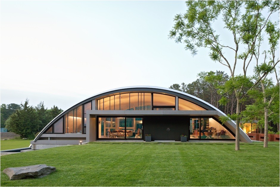homes above and below airplane hangar and underground homes